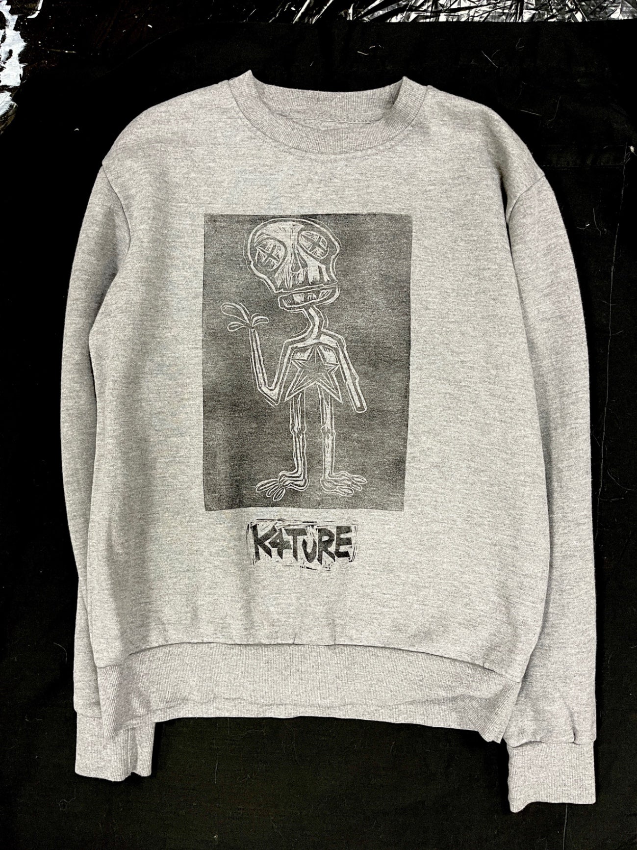 Grey sweatshirt with skeleton graphic