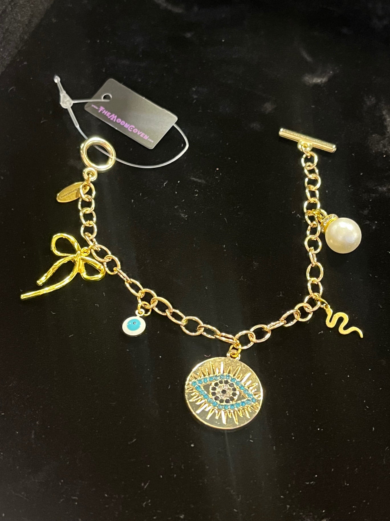 Mystic Bow & Evil Eye T-Bar Charm Bracelet – Gold