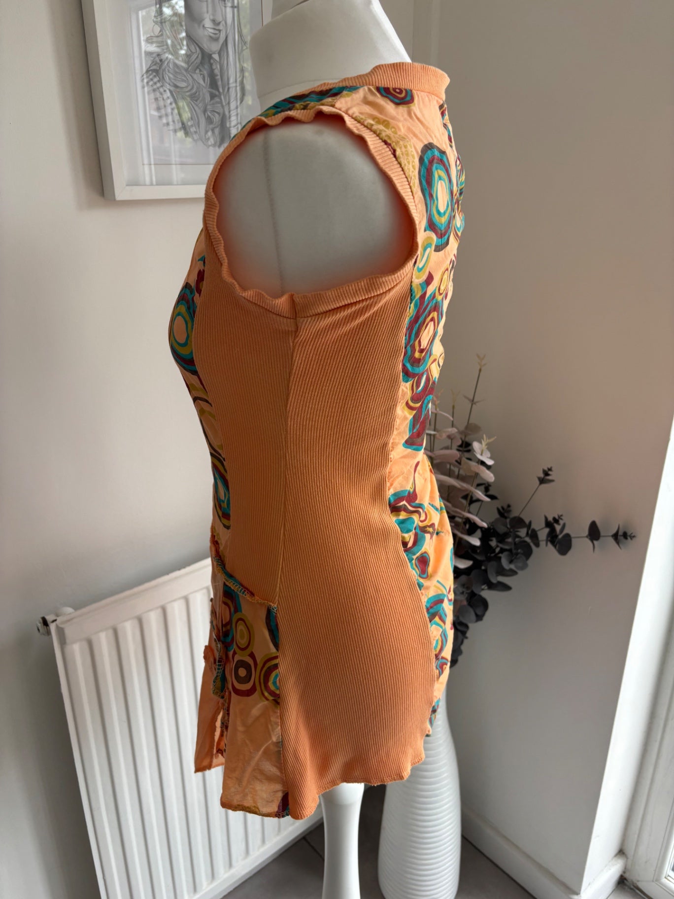 Orange shirt top with colourful swirls