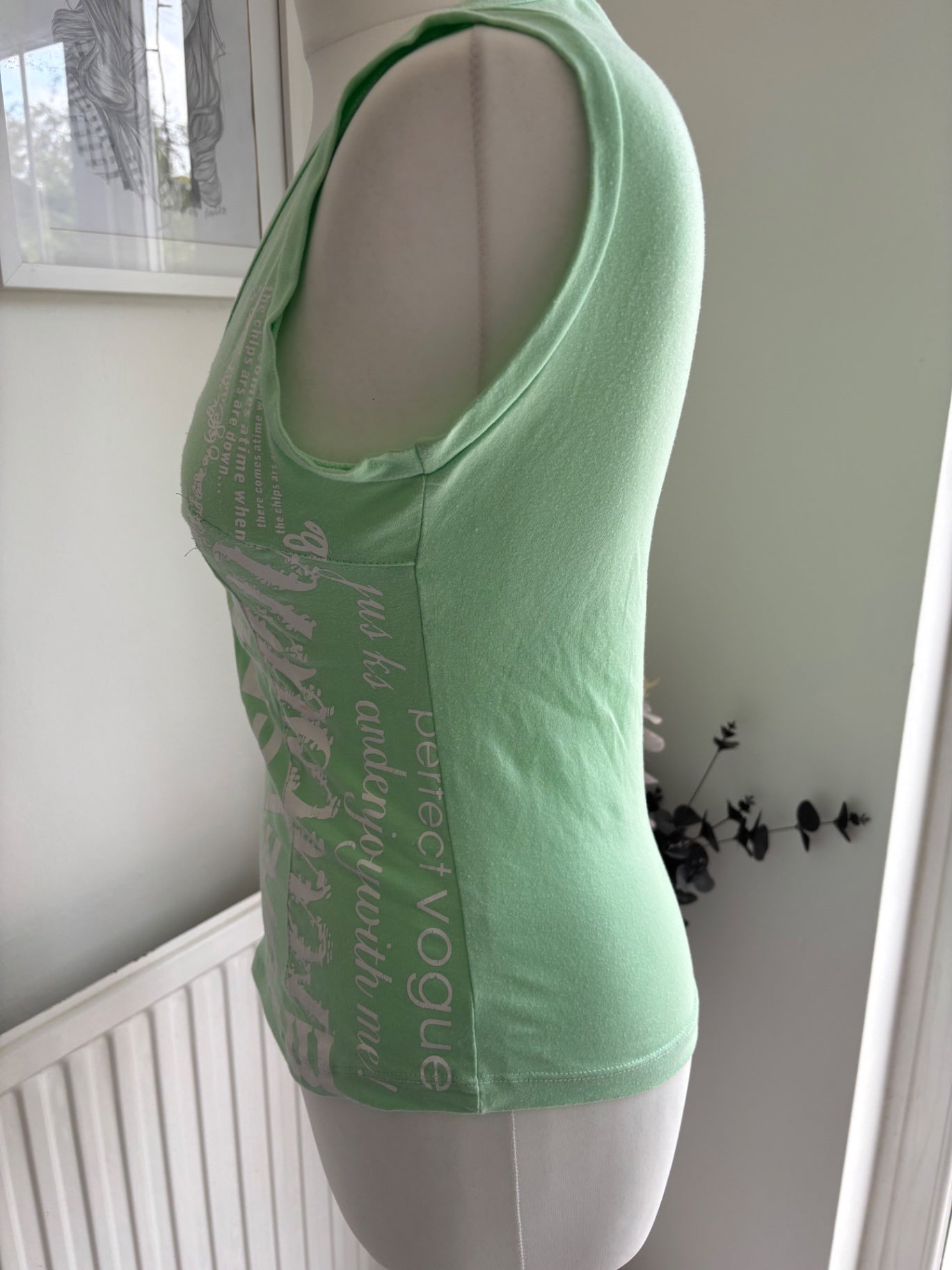 Green top with writing on