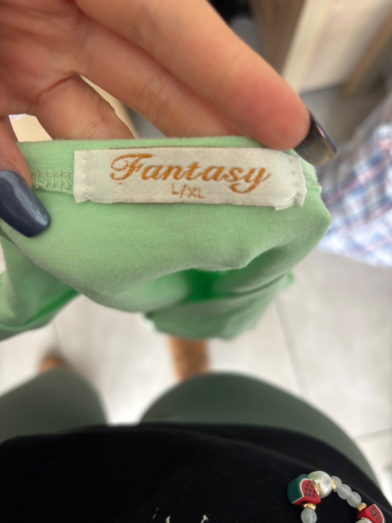 Green top with writing on
