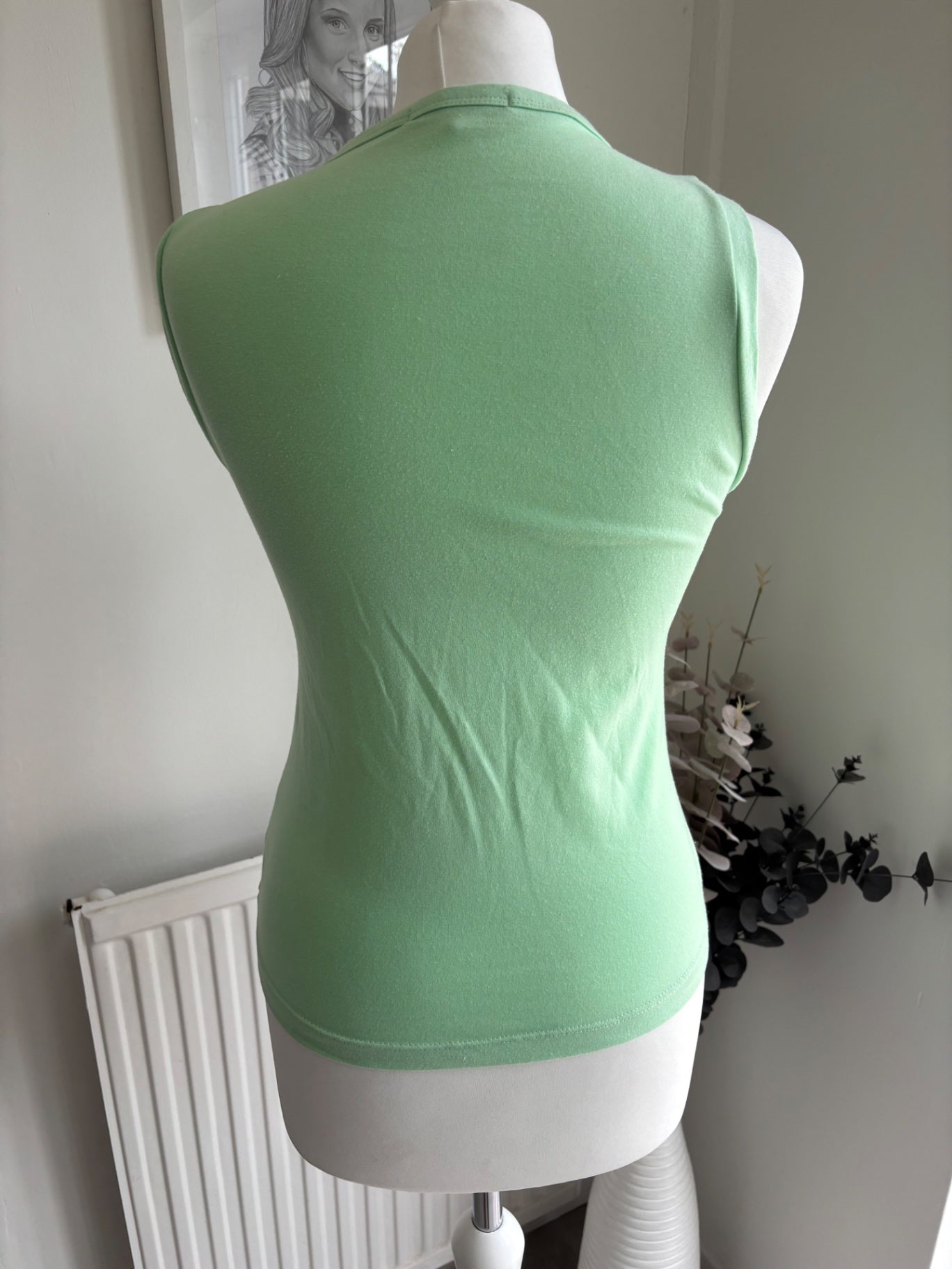 Green top with writing on