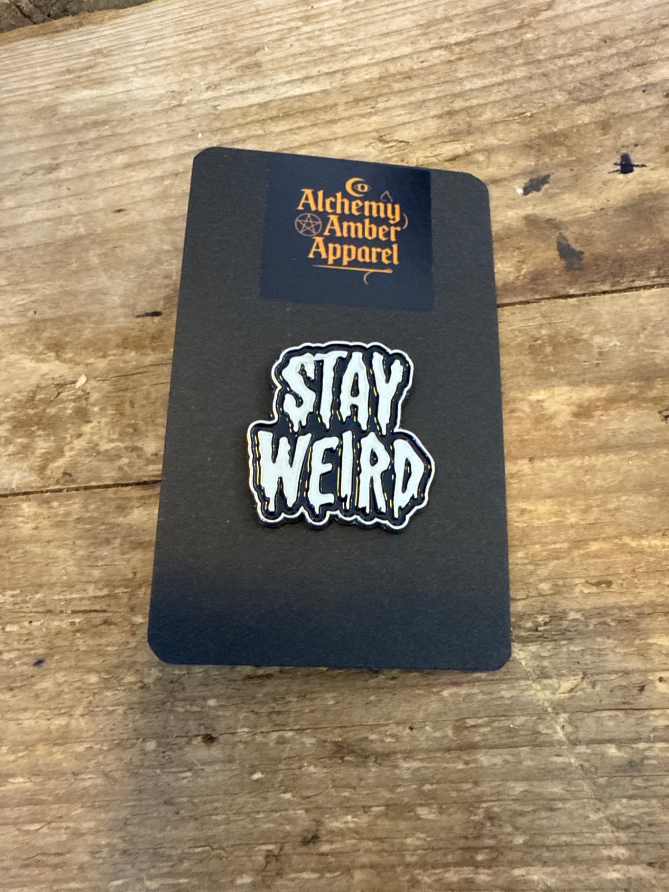Stay weird pin badge