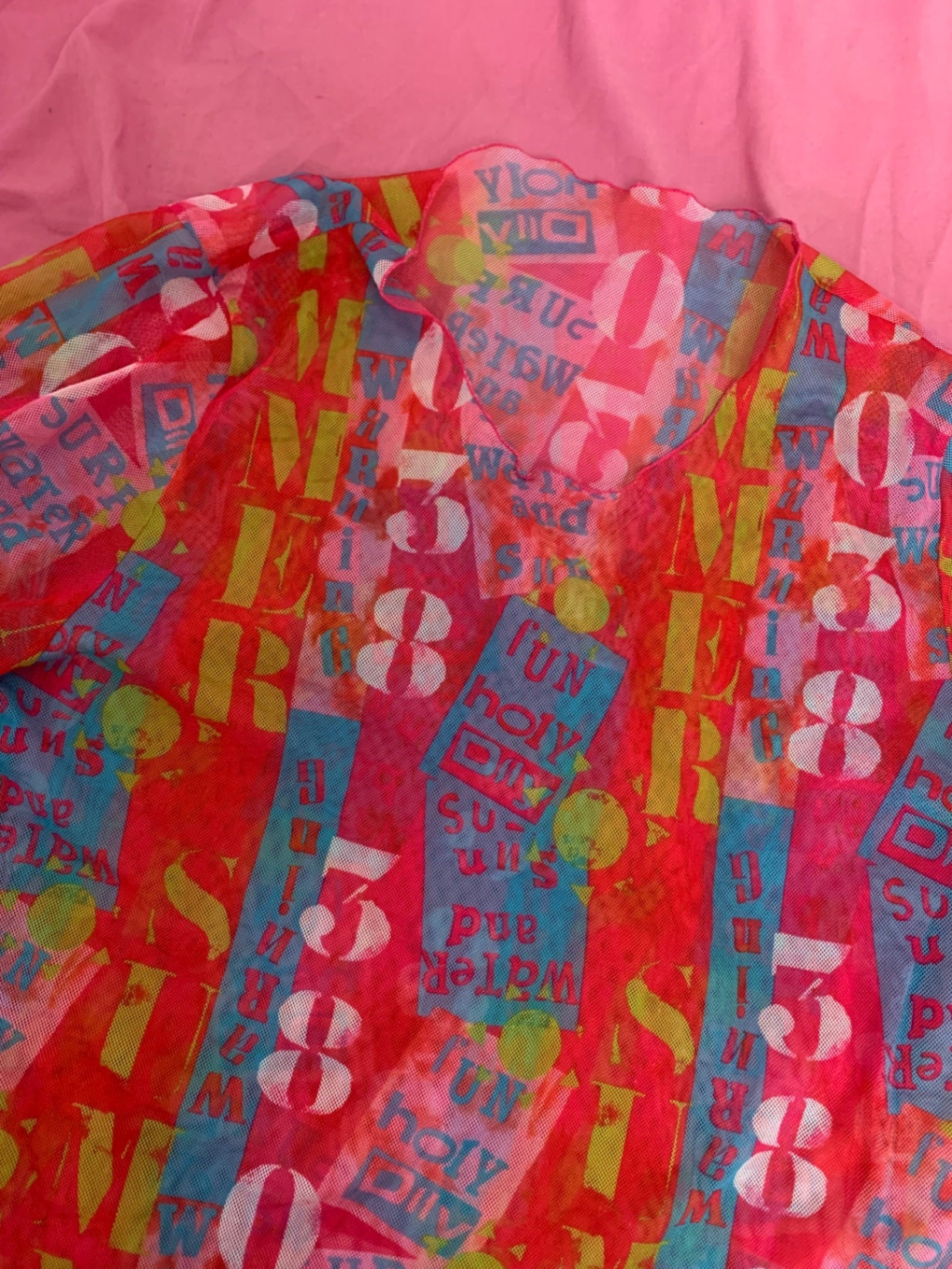 colourful graphic mesh top