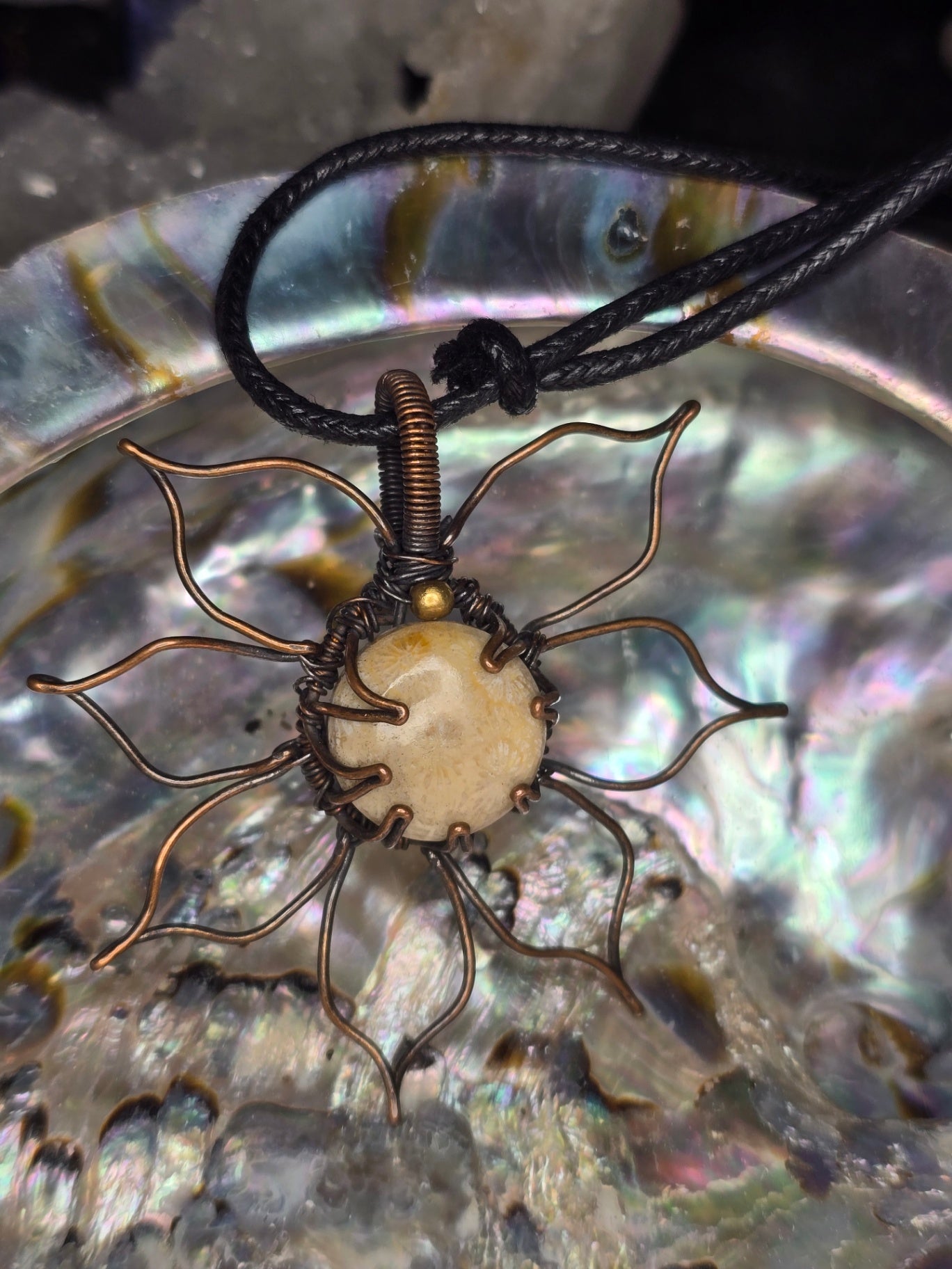Fossilised coral flower pendant