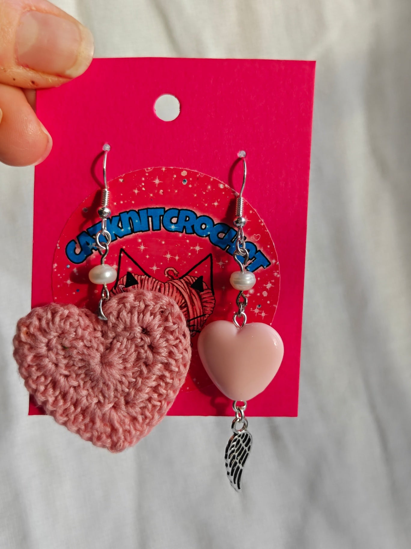 Mismatched earrings, pink heart with natural pearl and angel wing