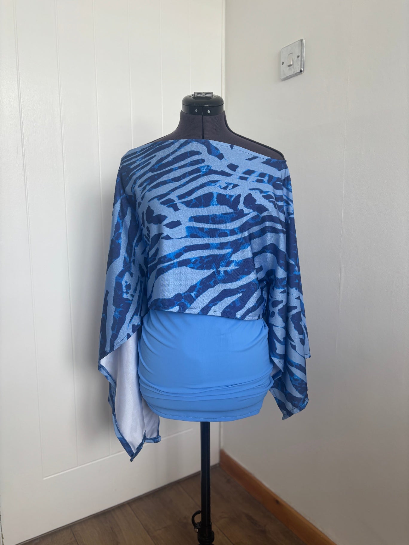 poncho top and mini skirt