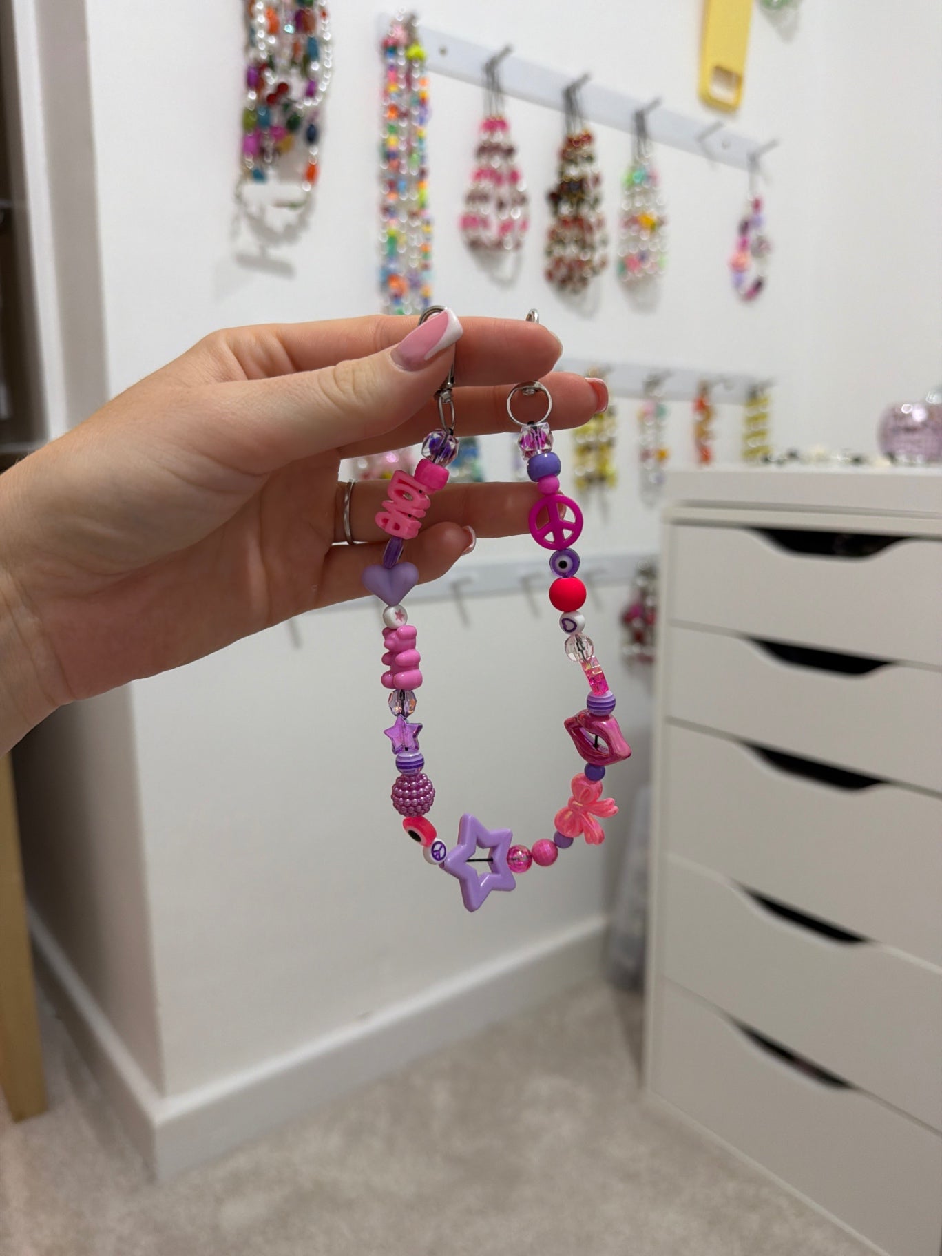 Pink and purple bag charm