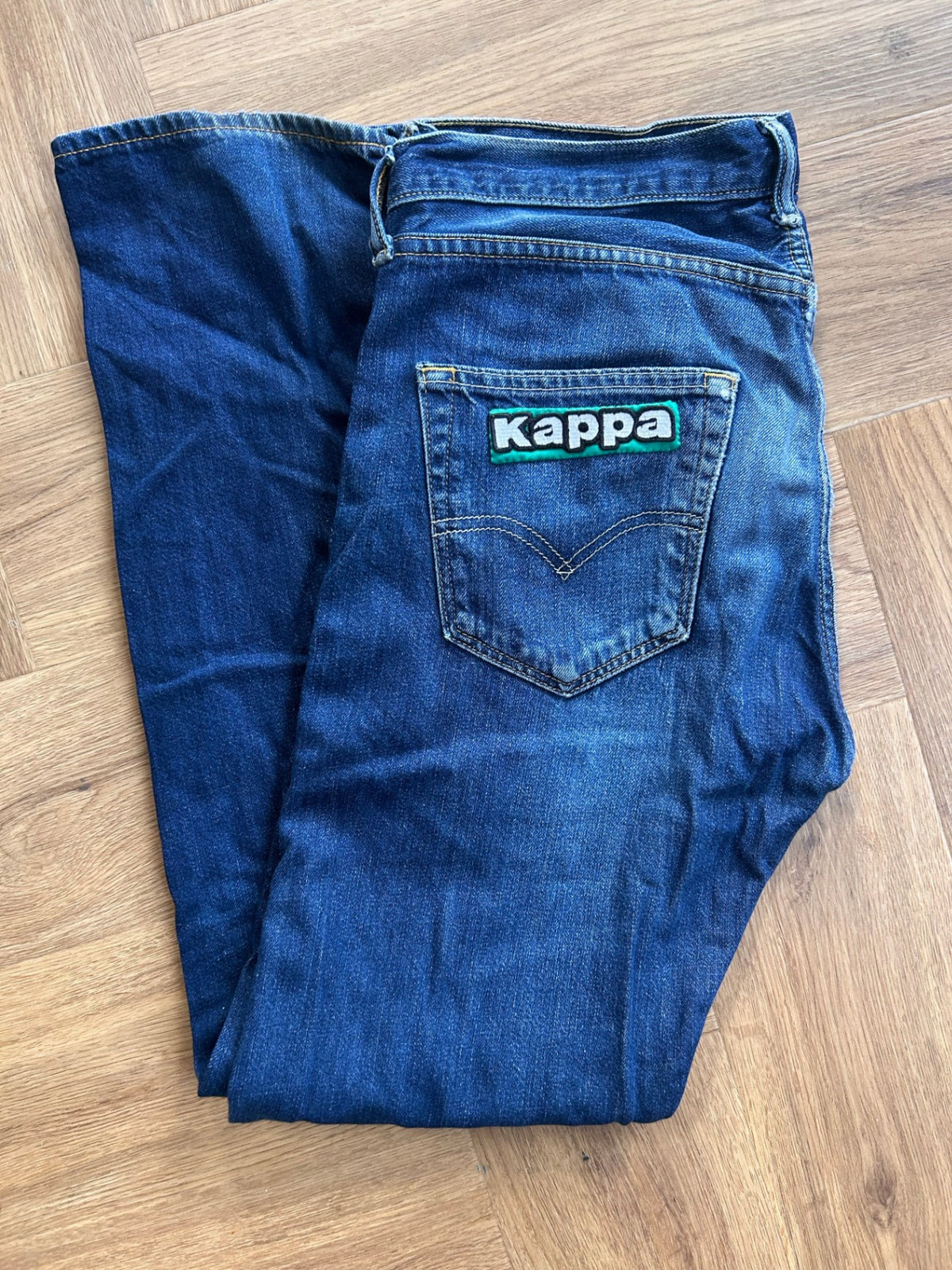 Upcycled Levi's with Kappa logo.
