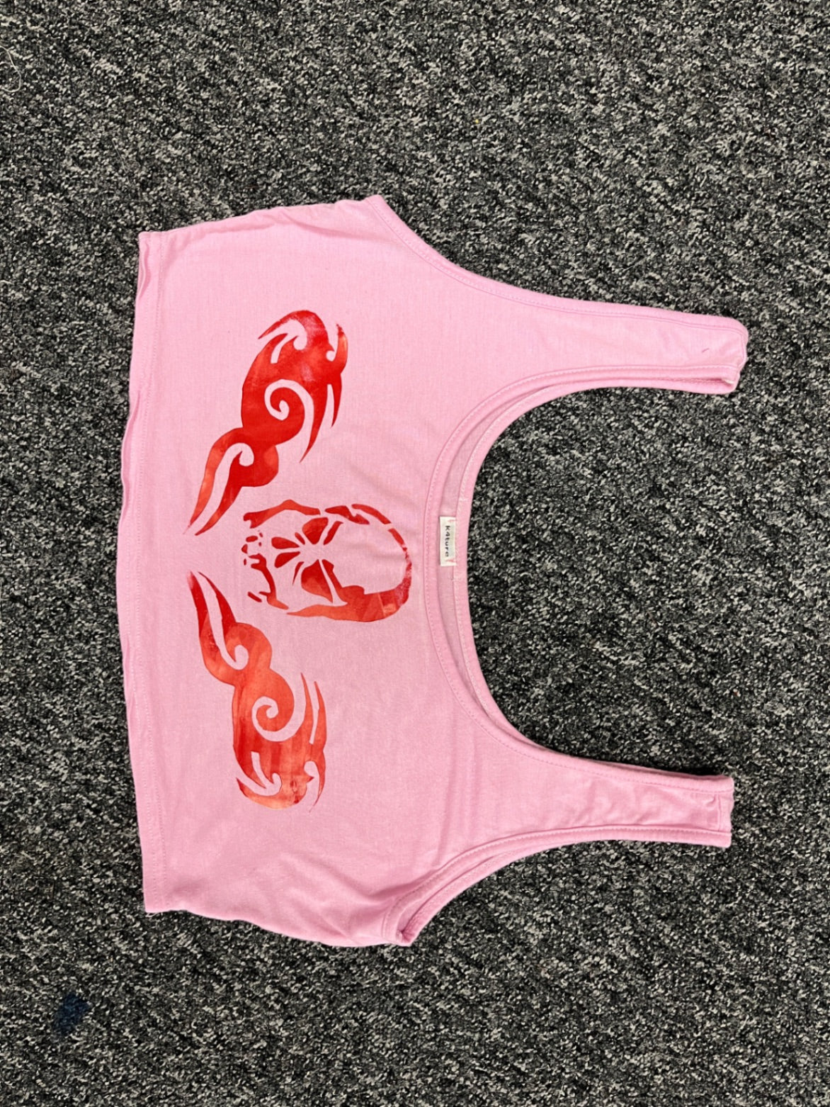 Baby pink scoop neck crop top with red tramp stamp design 