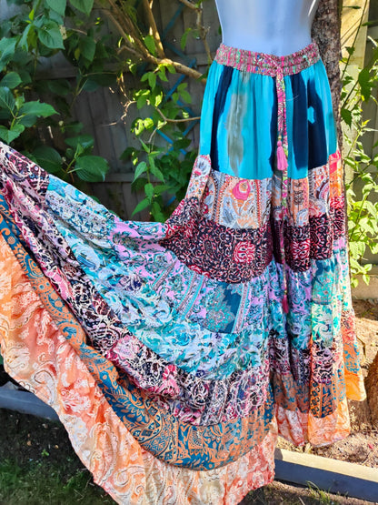 Patchwork flares with pink tassel ties