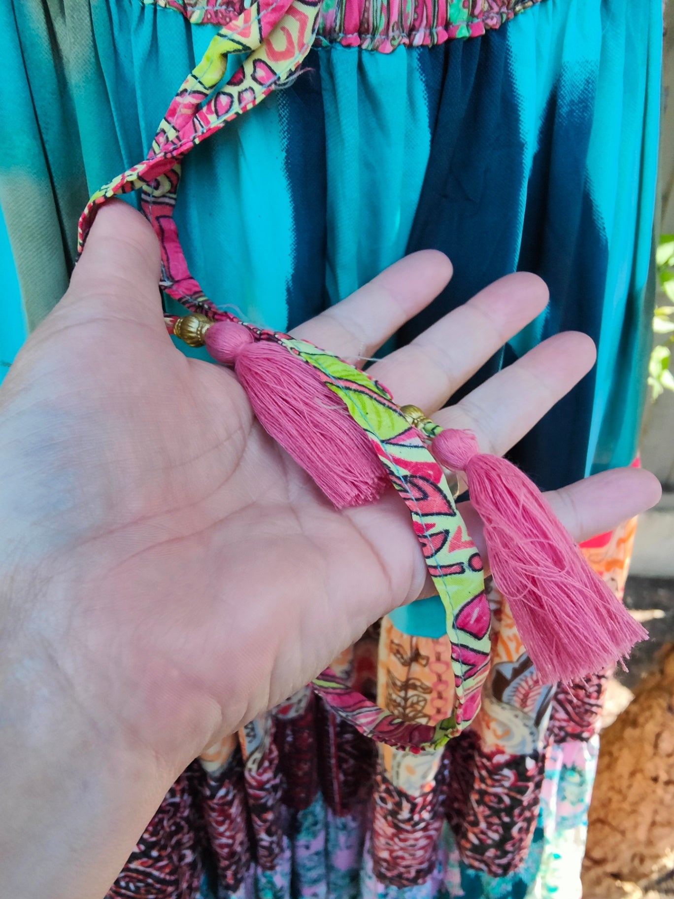 Patchwork flares with pink tassel ties