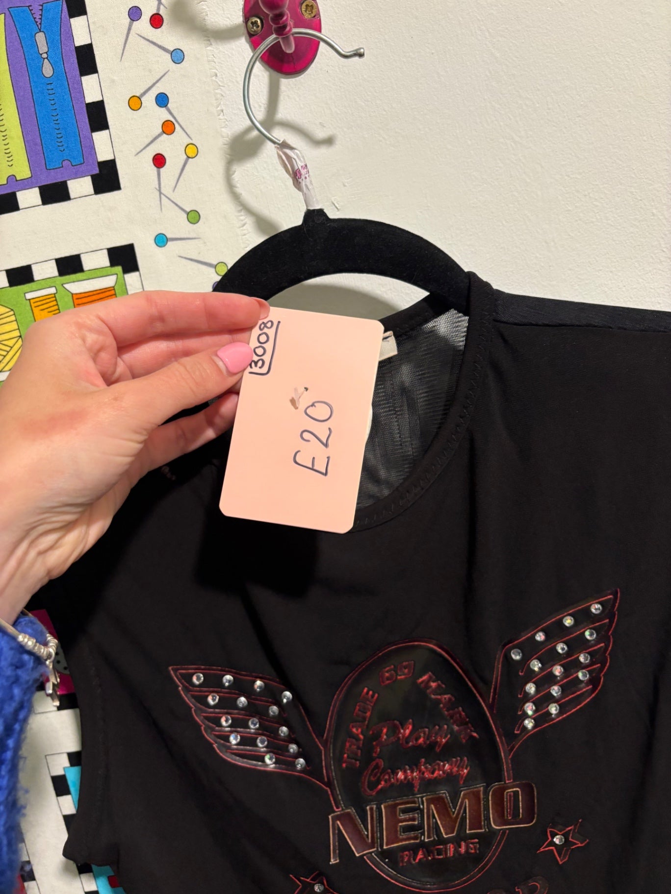 Black sleeveless top with graphic on 