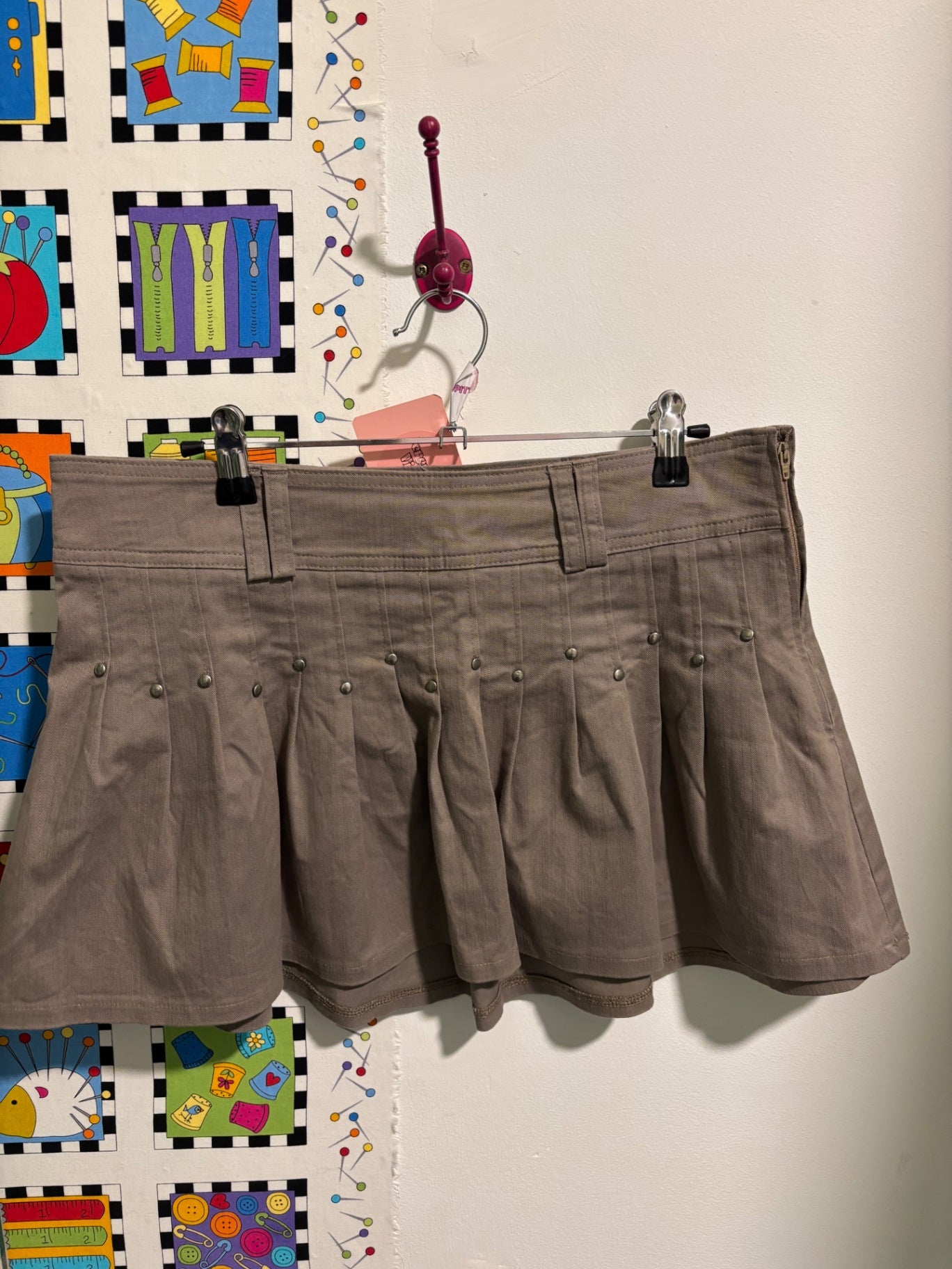 Khaki pleated mini skirt
