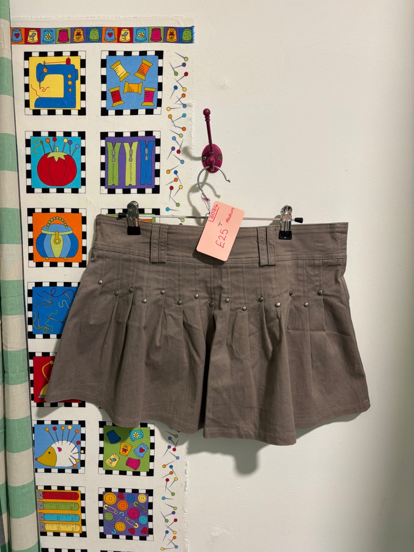 Khaki pleated mini skirt