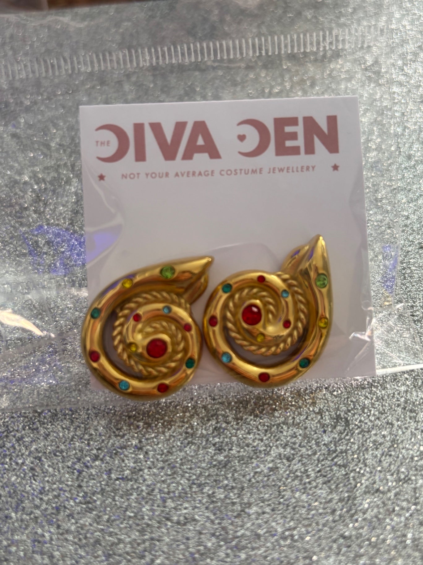 Gold swirl earrings With multi rhinestones 