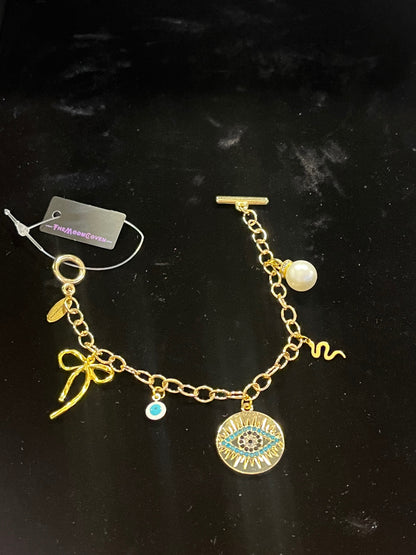 Mystic Bow & Evil Eye T-Bar Charm Bracelet – Gold
