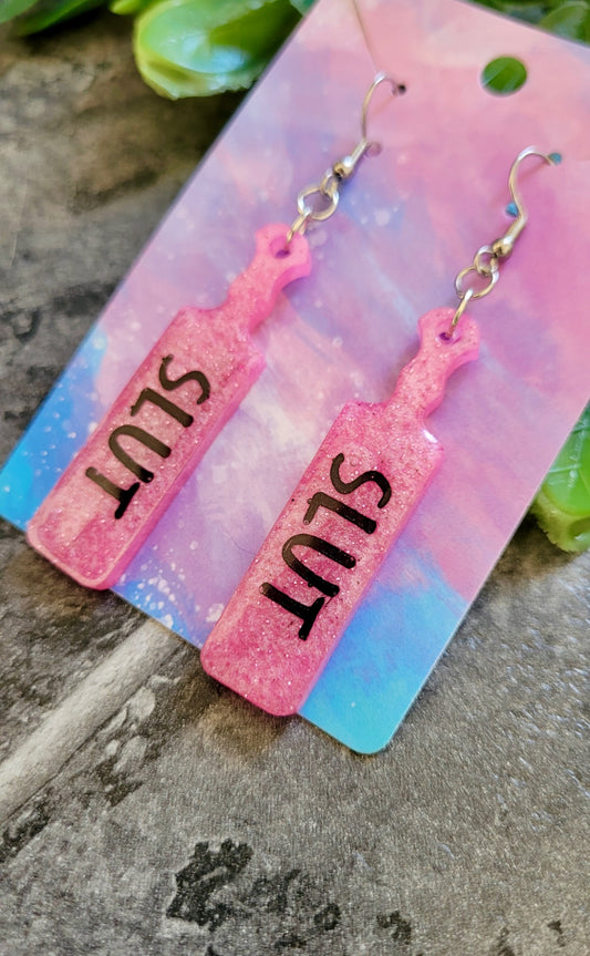 Pink Glitter Paddle Earrings – “SLUT” Indent Text – Alt NSFW Statement Jewellery