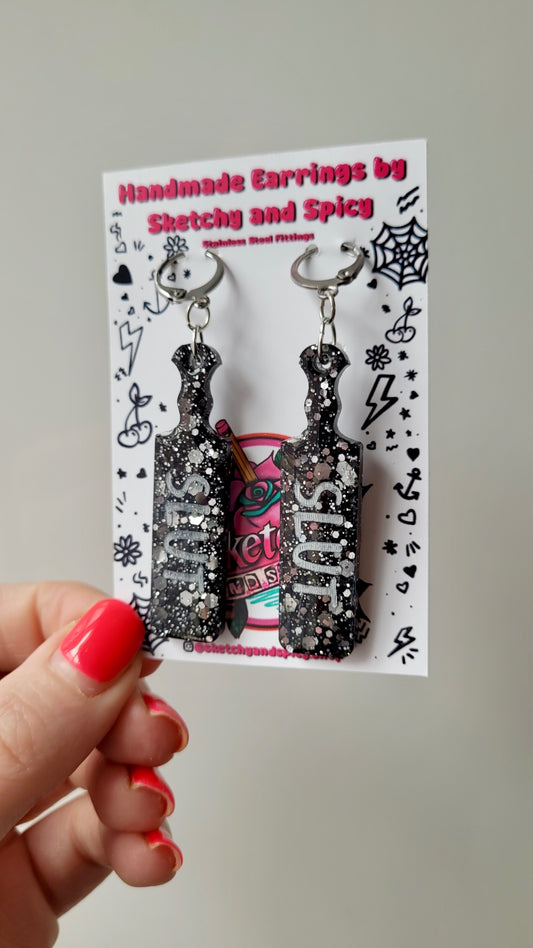 Black Glitter Paddle Earrings – “SLUT” Indent Text in Silver – Alt Statement Jewellery