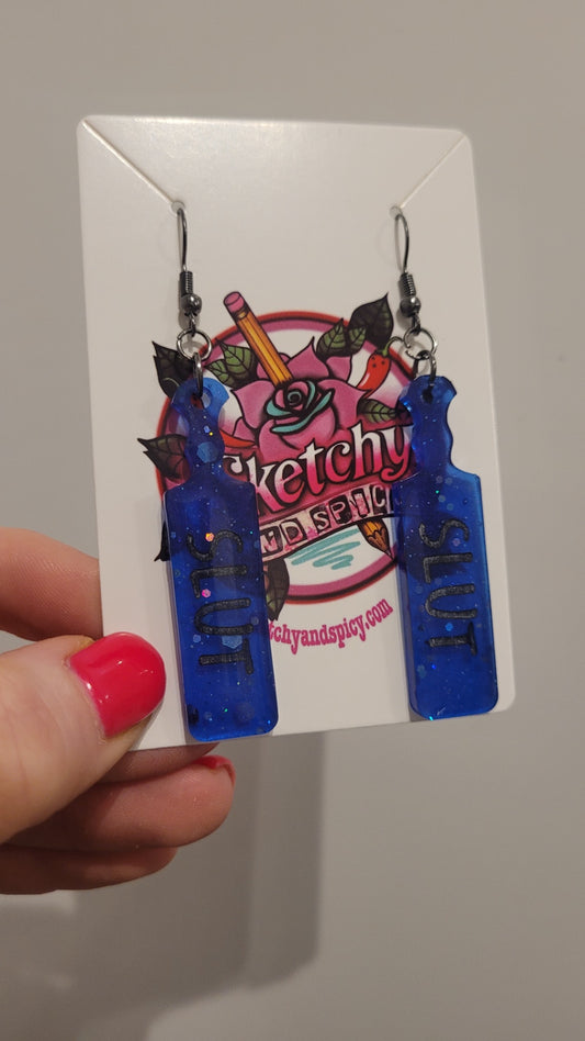 Dark Blue Glitter Paddle Earrings – “SLUT” in Black Text | Handmade Resin | Sketchy & Spicy