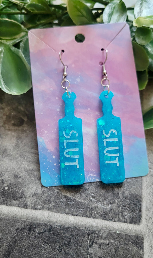 Turquoise Blue Glitter Paddle Earrings – “SLUT” in White Text | Handmade Alt Resin Jewellery