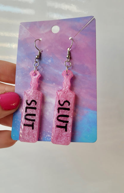 Pink Glitter Paddle Earrings – “SLUT” Indent Text – Alt NSFW Statement Jewellery