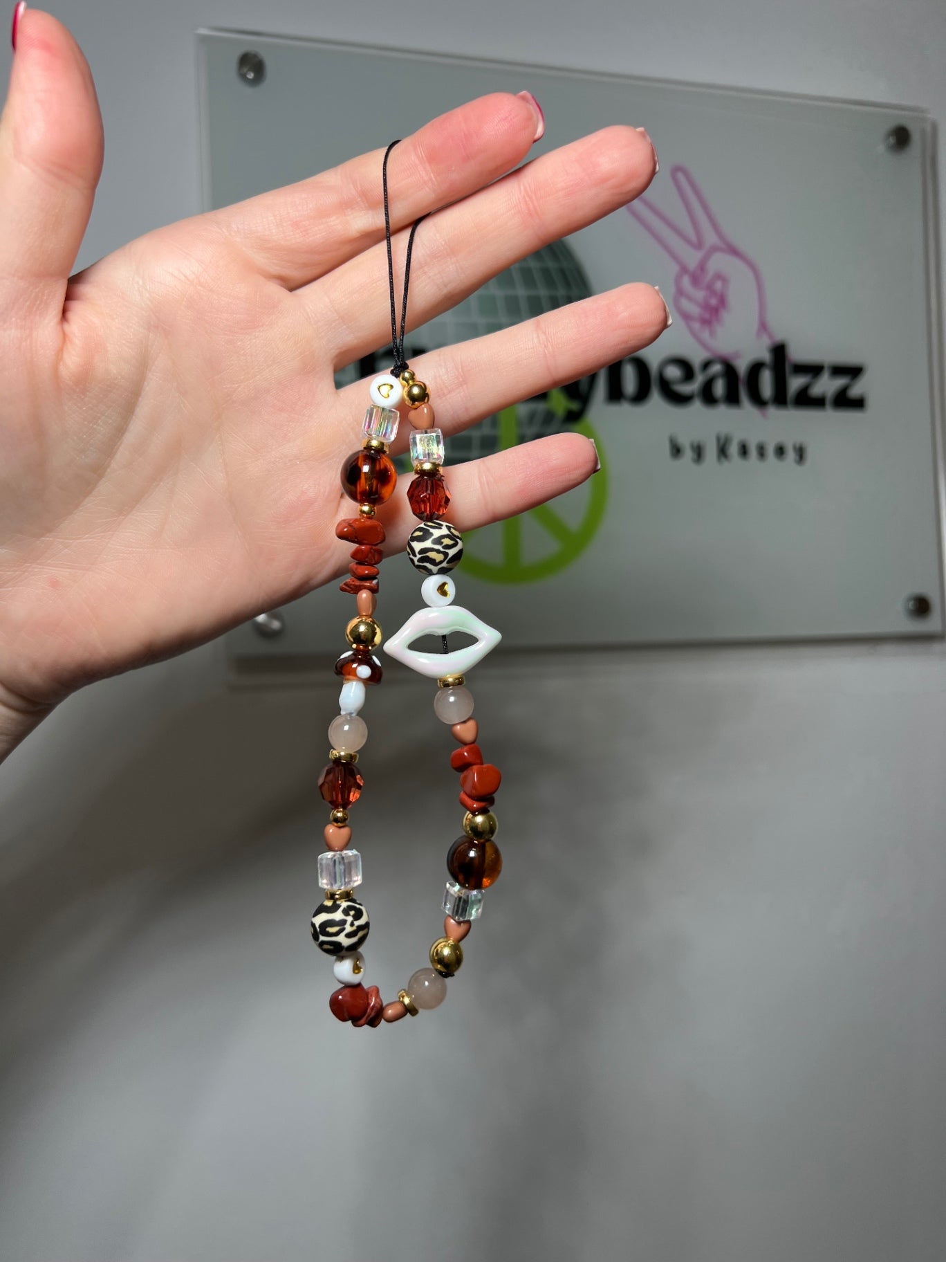 Cat eye phone charm