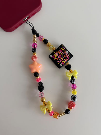 ‘Bad vibes don’t go with my outfit’ phone charm