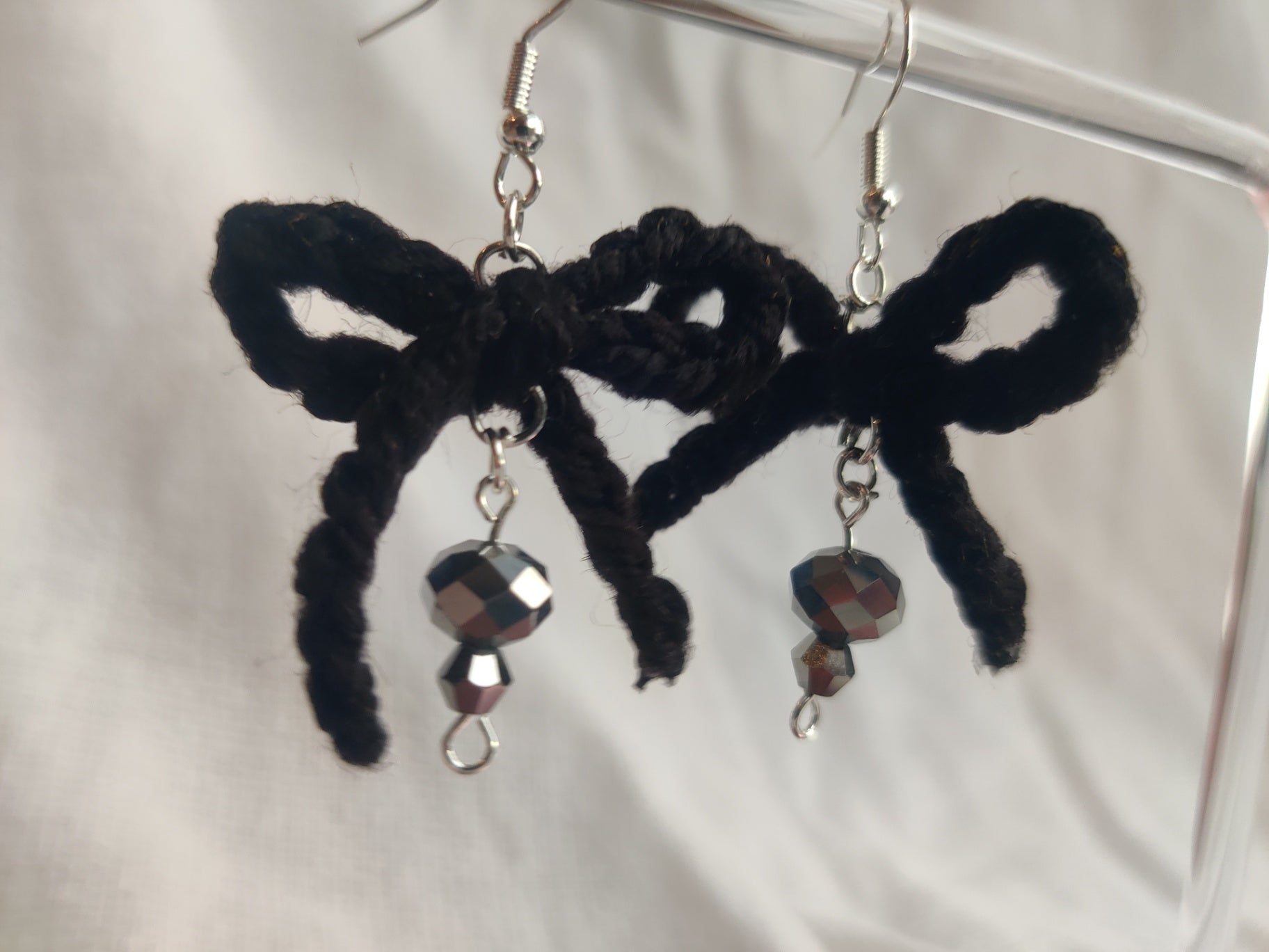 Black crochet bow earrings, disco beads