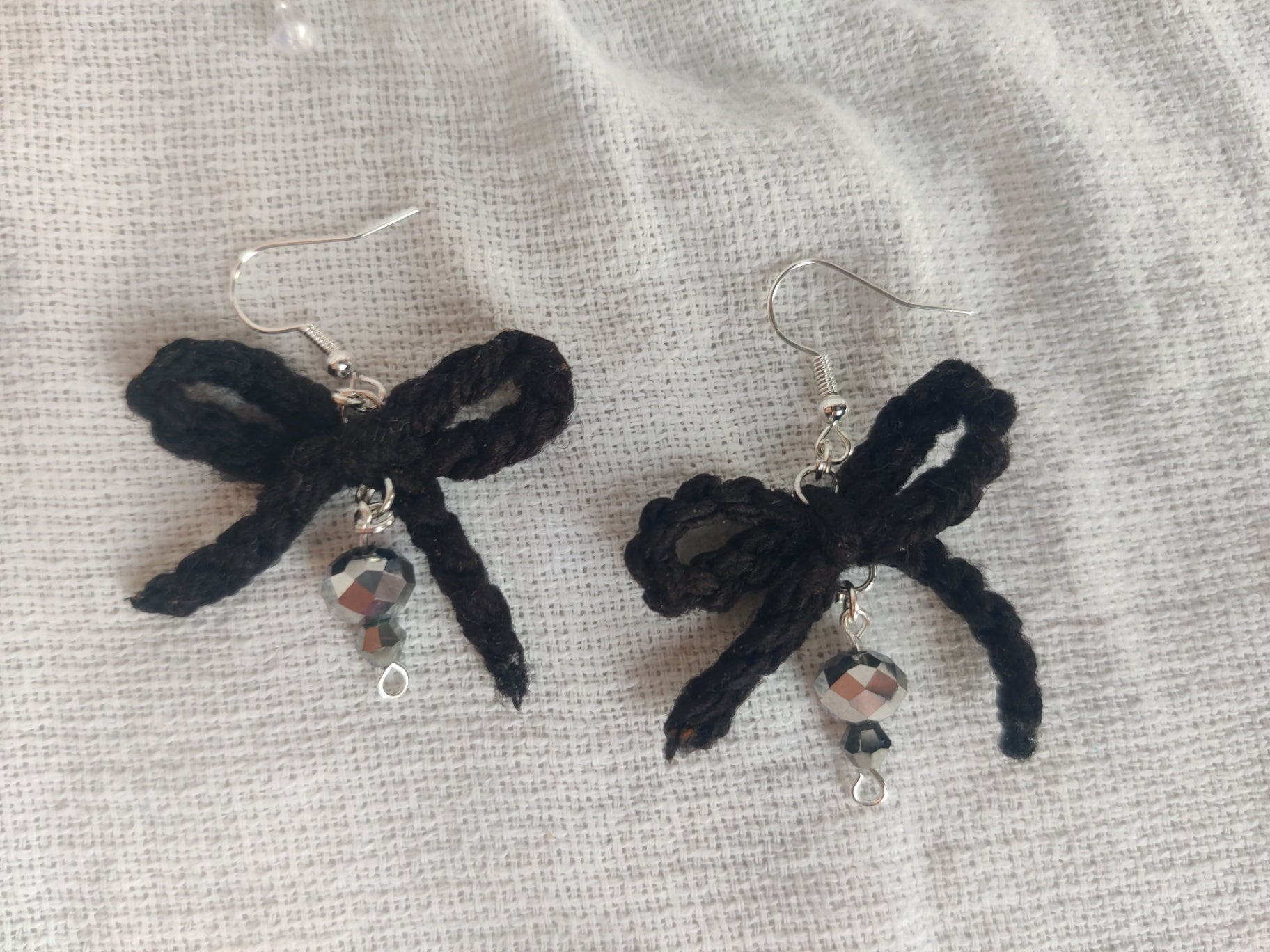 Black crochet bow earrings, disco beads