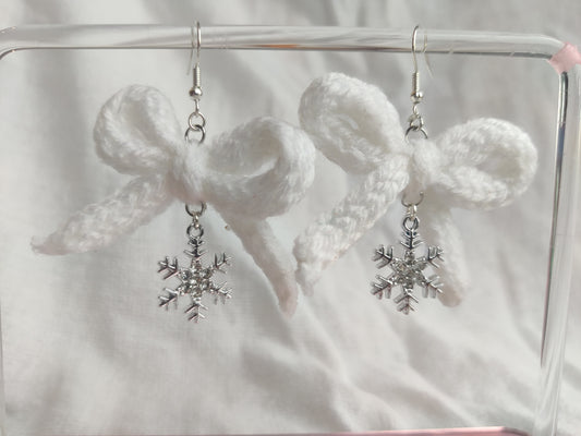 White crochet bows with sparkly snowflake charms