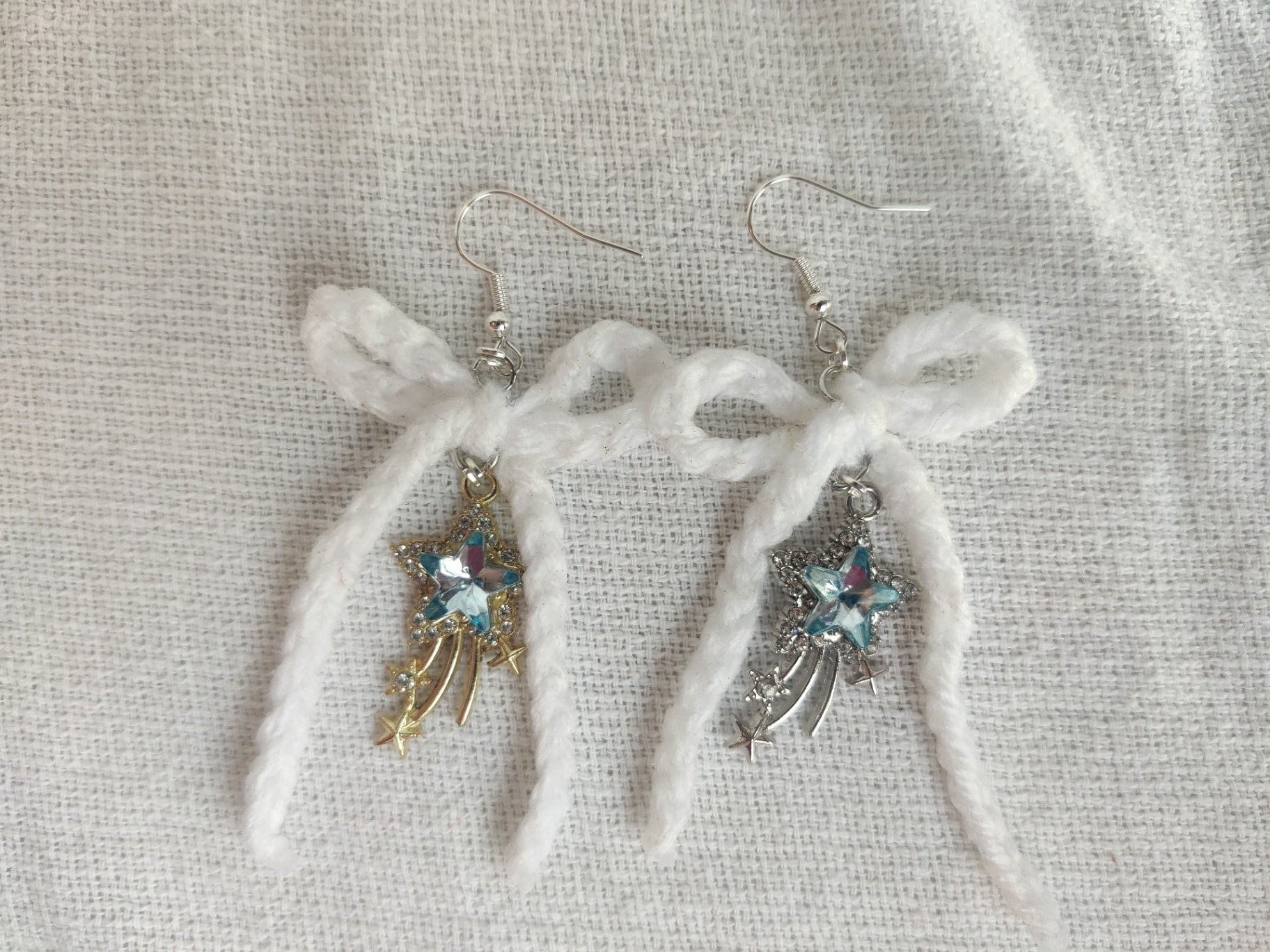 White crochet bows with sparkly star charms