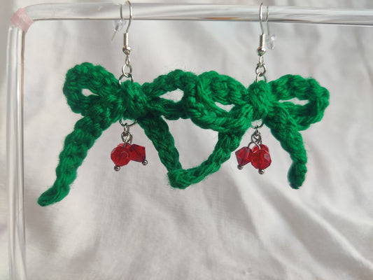 Crochet green bow earrings with red glass beads, holly berry