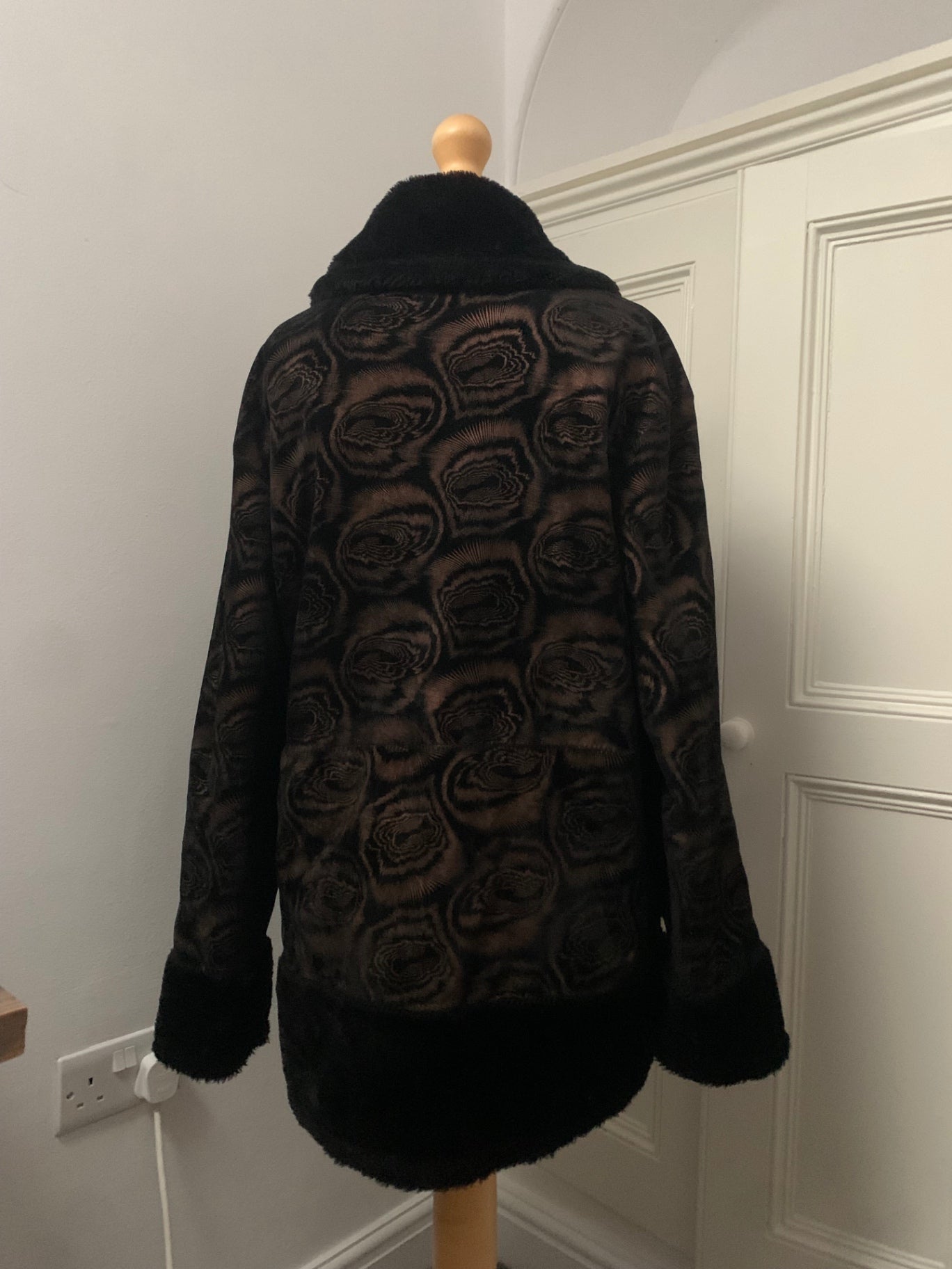 black faux fur geometric rose pattern coat