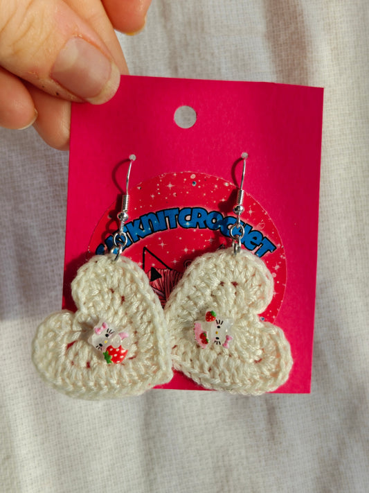 White crochet heart earrings with hello kitty charms