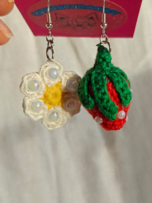 Mismatched earrings, strawberry and flower