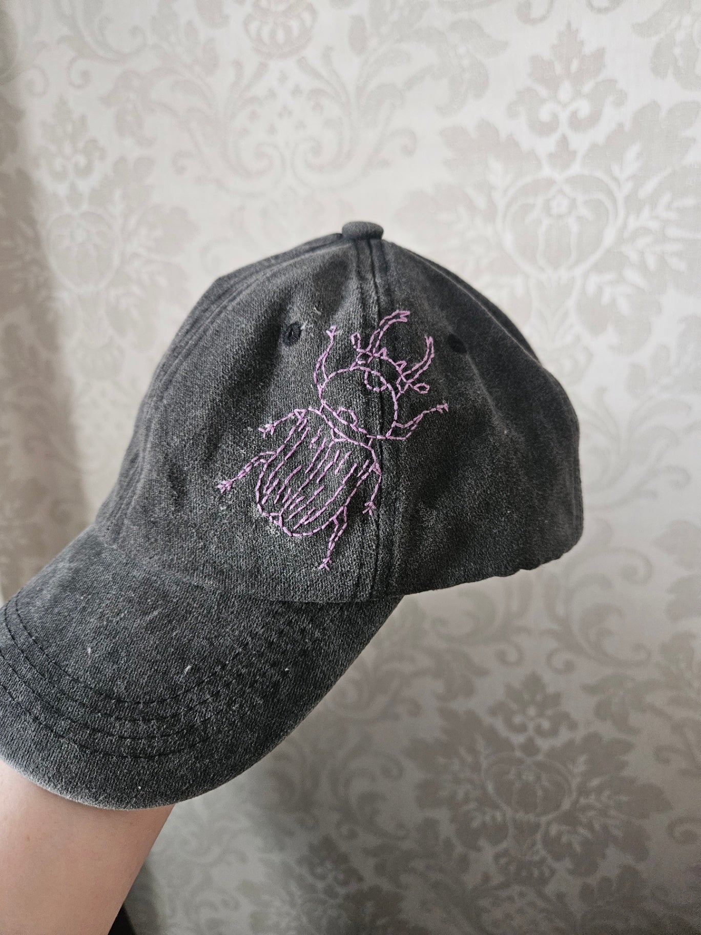 Black distressed bug cap