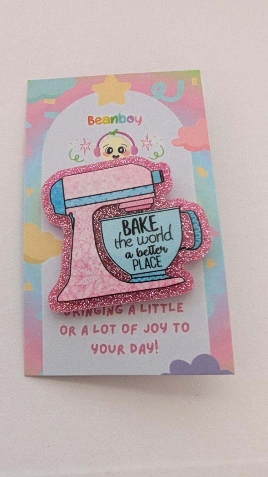 Bake the world a better place Pin Badge