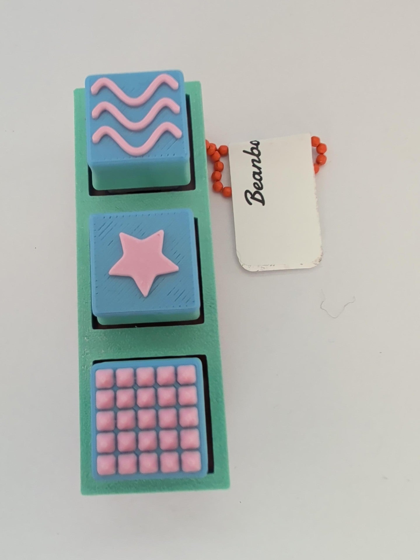 Spiky Brick Clicker Keychain blue star/waves
