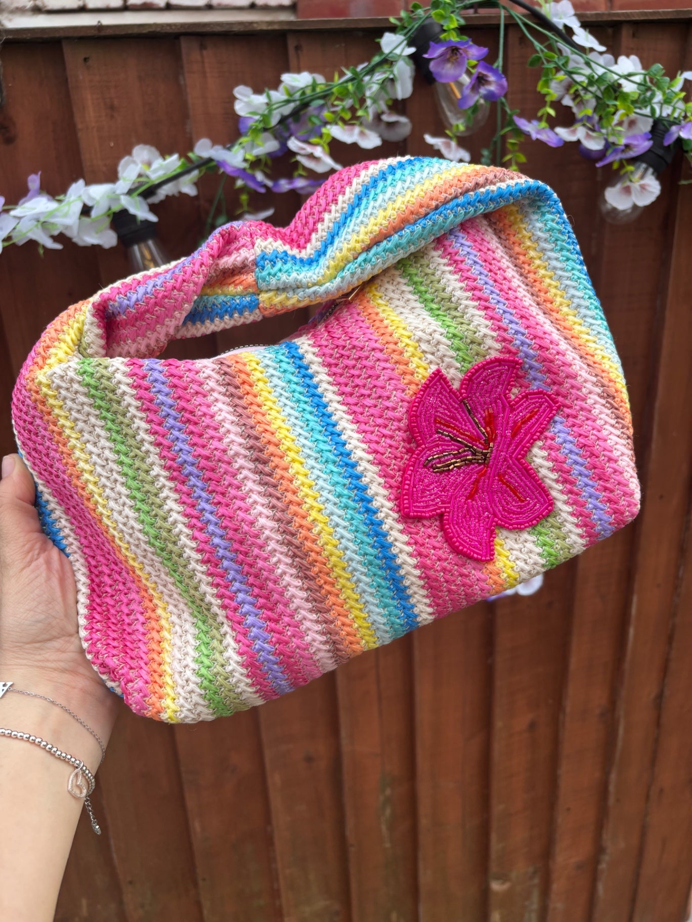Multicoloured bag with Pink orchid patch 