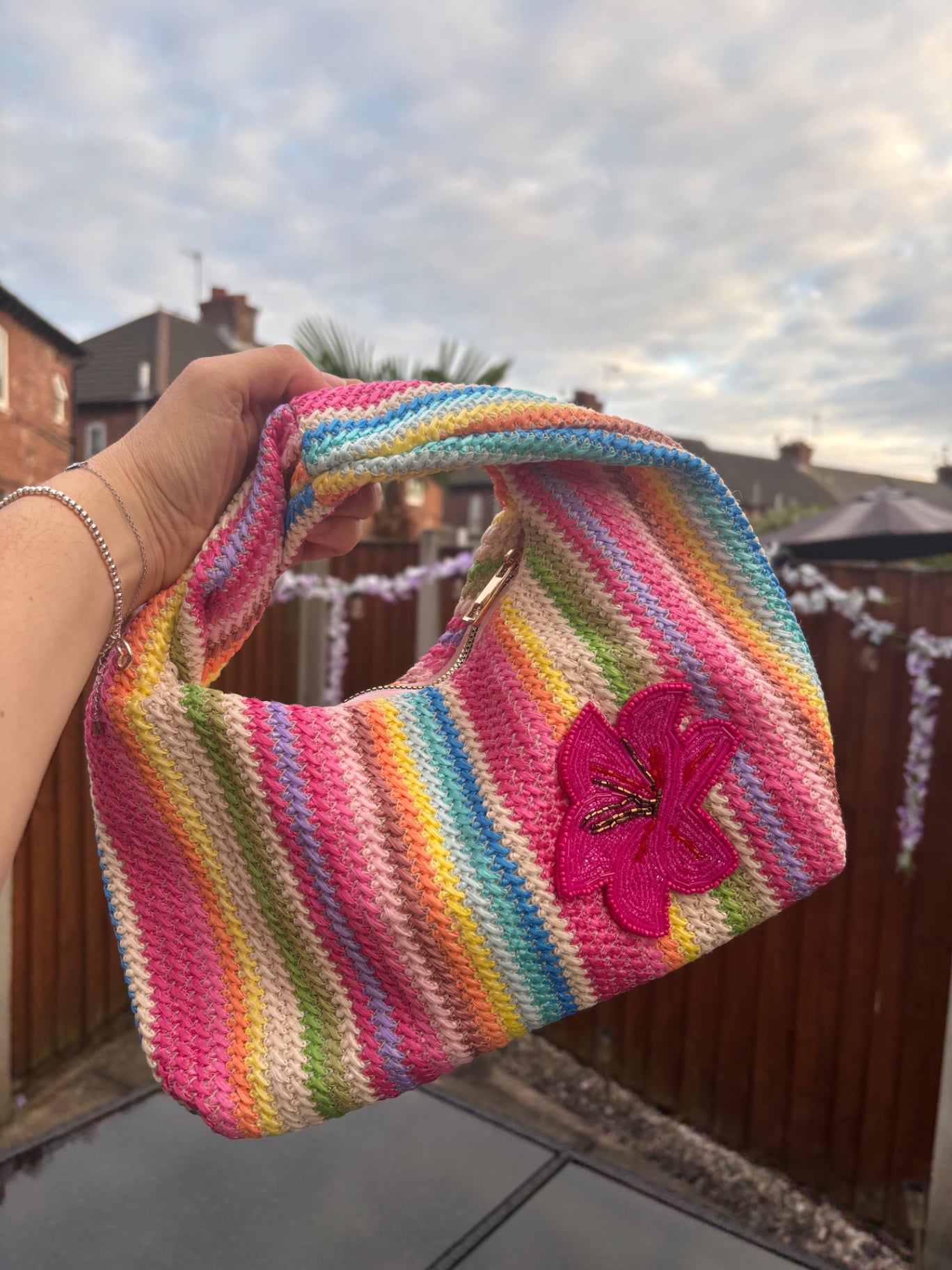 Multicoloured bag with Pink orchid patch 