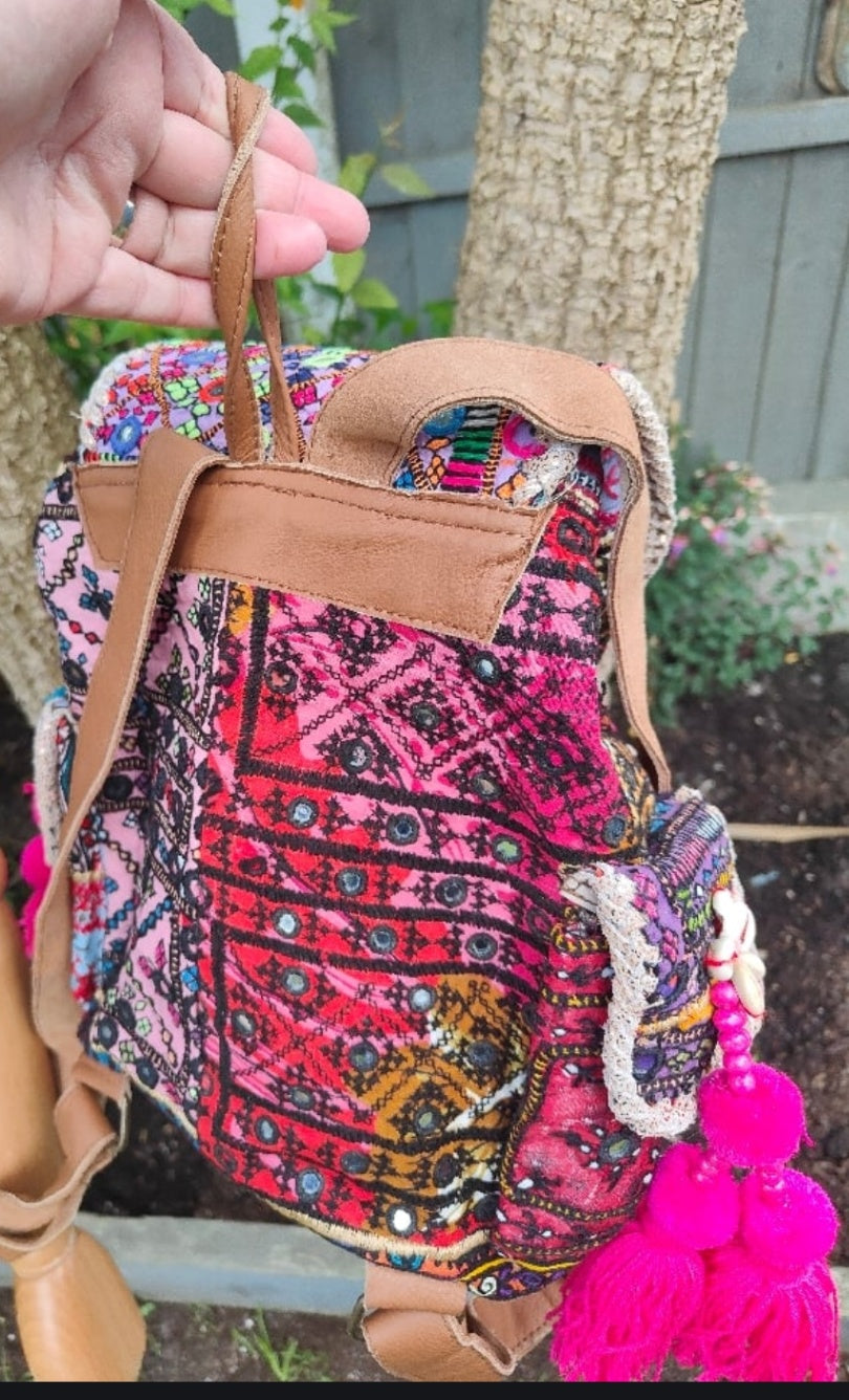 Skiathos backpack embellished with pom poms and charms