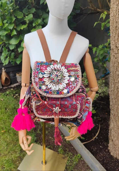 Skiathos backpack embellished with pom poms and charms