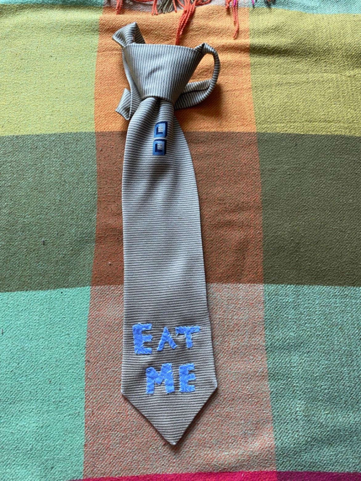 BLUE EAT ME Up-cycled tie with hand sewn design