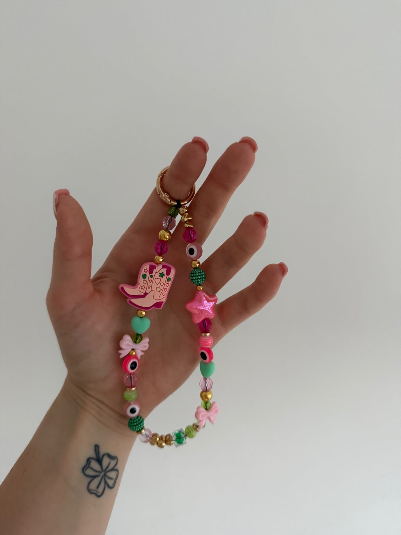 ‘Cowgirl’ phone charm - gold 