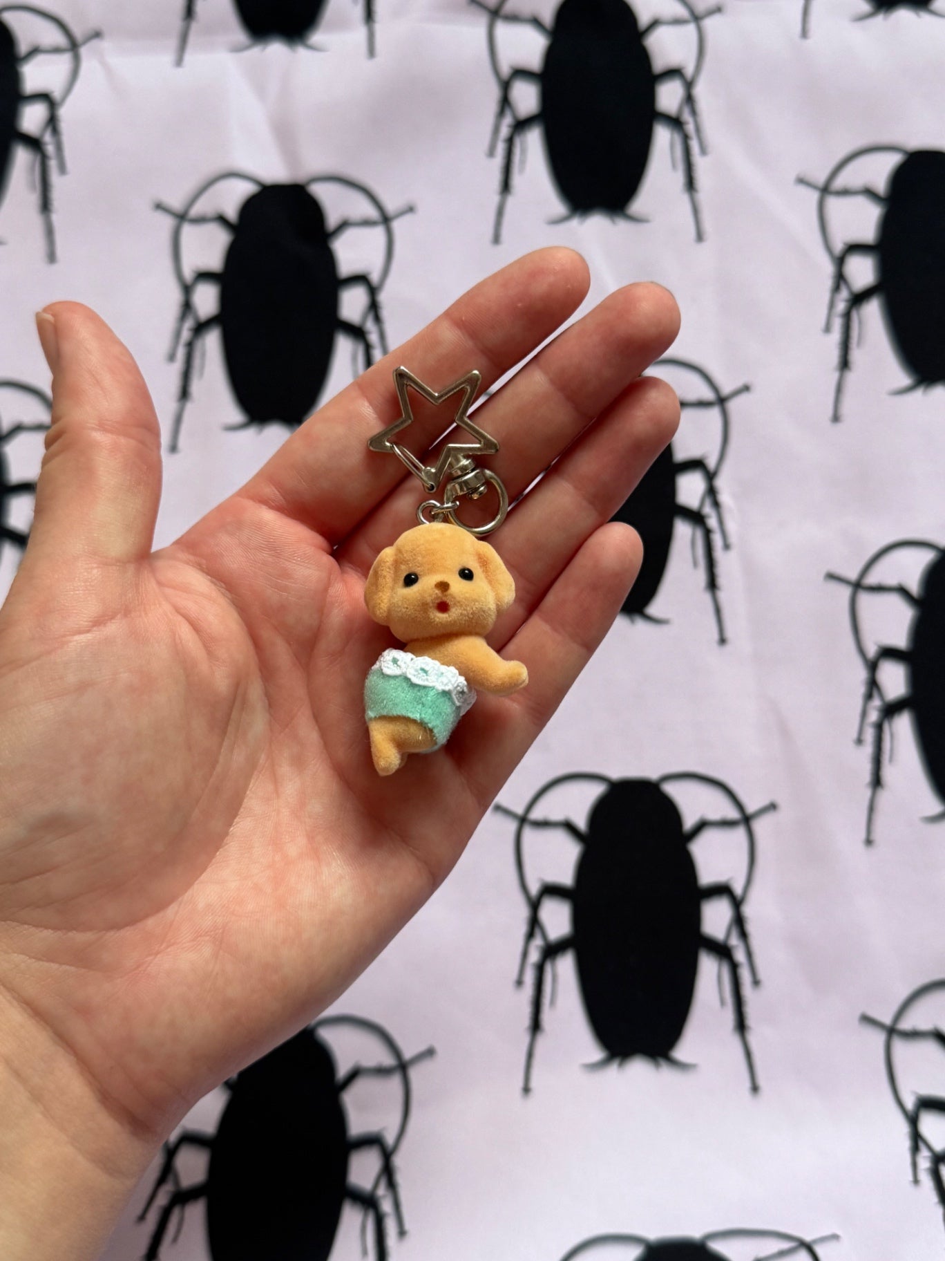 Crawling poodle keychain
