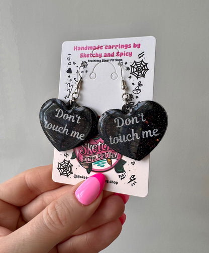 Black Glitter ‘Don’t Touch Me’ Heart Earrings
