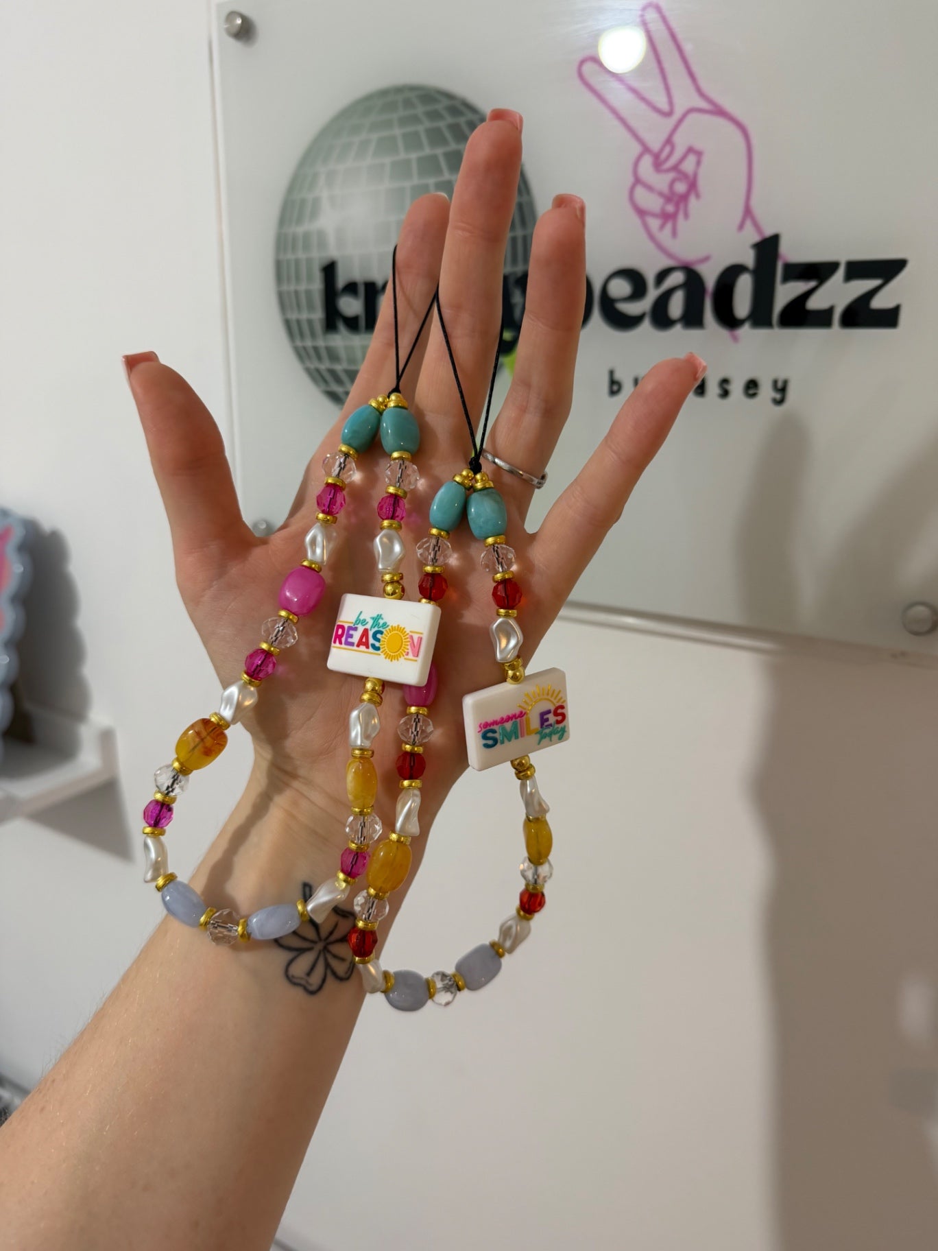‘Be the reason someone smiles today’ phone charm 
