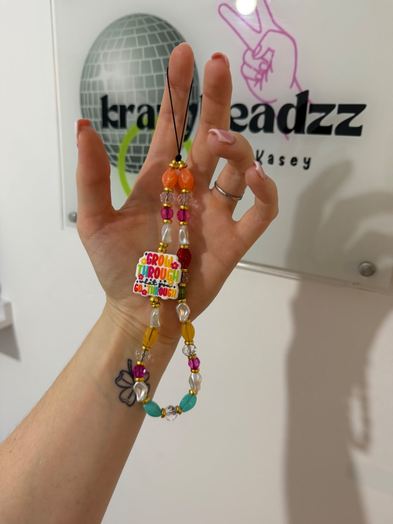 ‘Grow through’ phone charm
