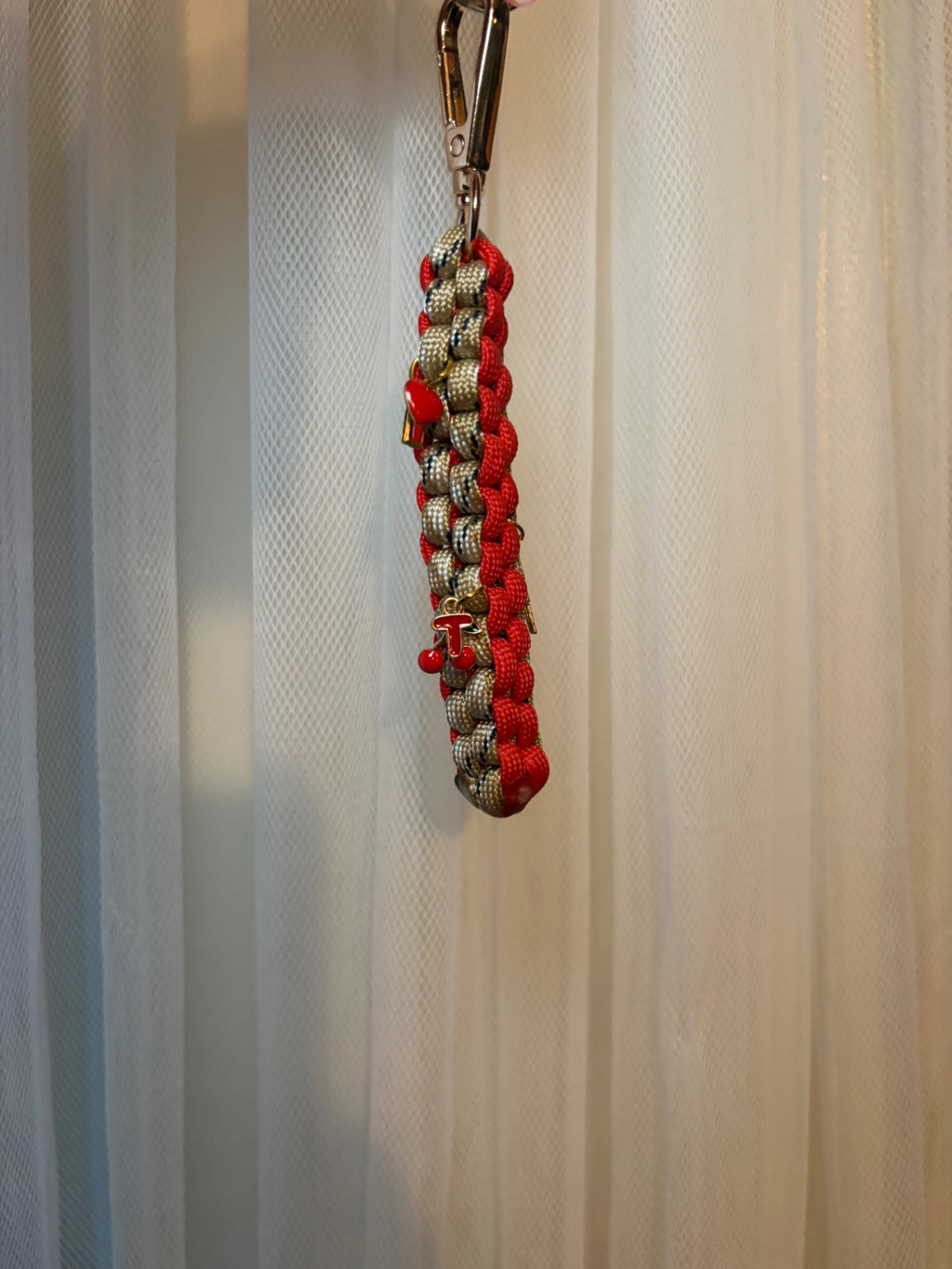 Red and beige charm keychain 